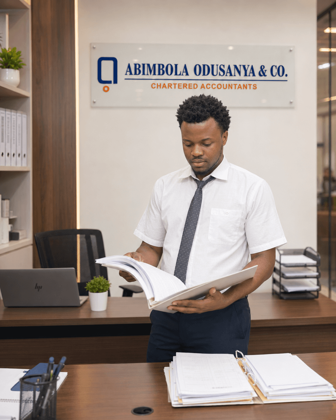 Abimbola Odusanya & Co. team member reviewing professional documents